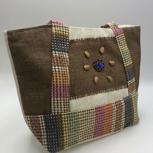 J Francis multicolored woven tote bag with zip top and inside slip pocket